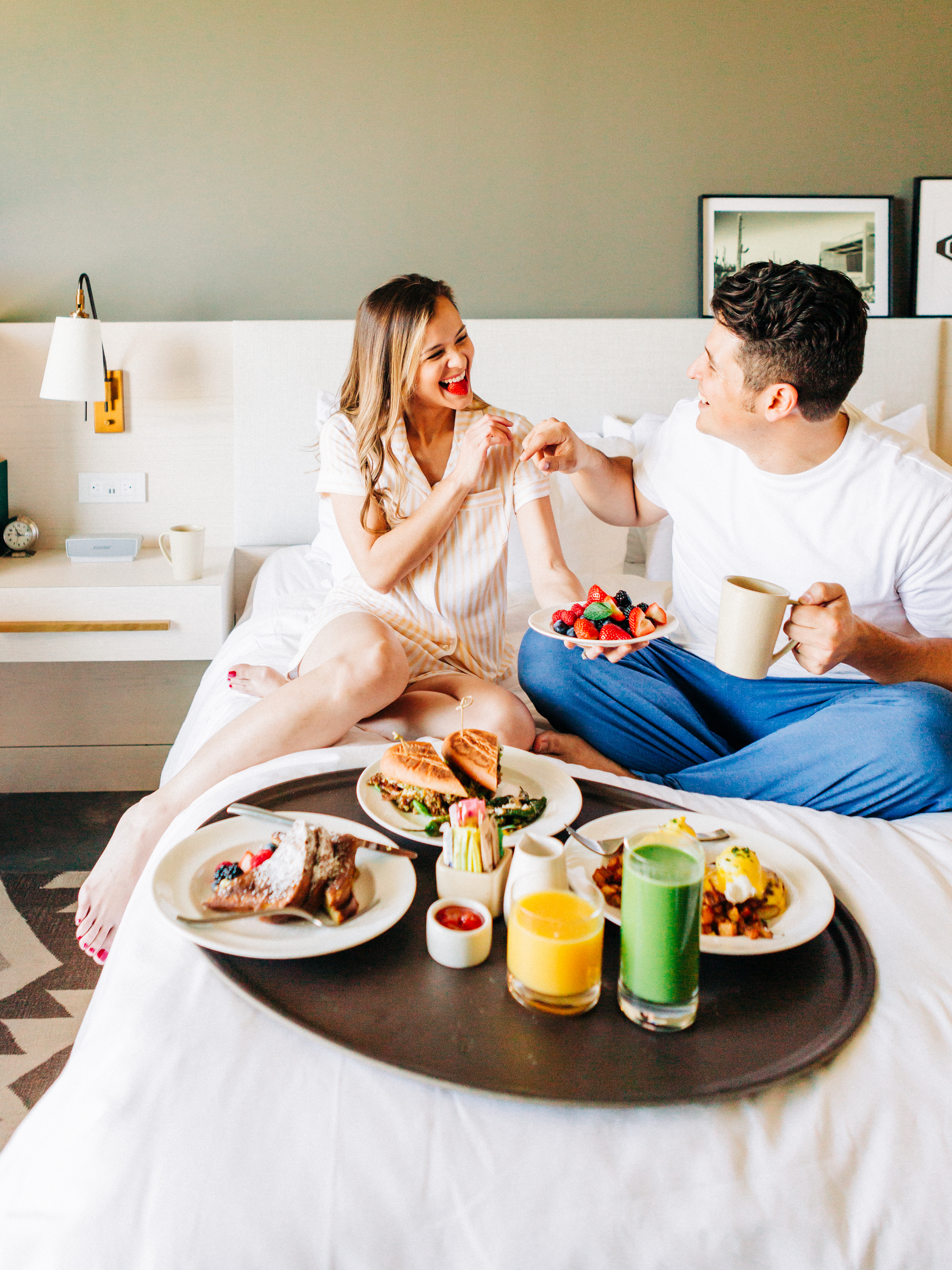 couple eating breakfast in bed 