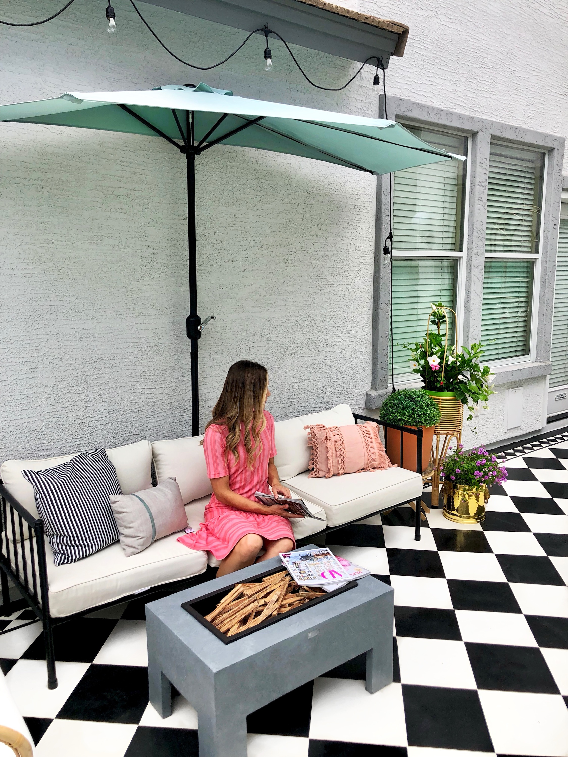 Outdoor Sofa and Umbrella on Black & White Patio 
